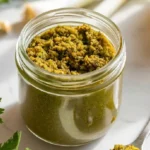 Caribbean Green Seasoning with fresh herbs, garlic, and Scotch bonnet peppers for bold, zesty flavors.